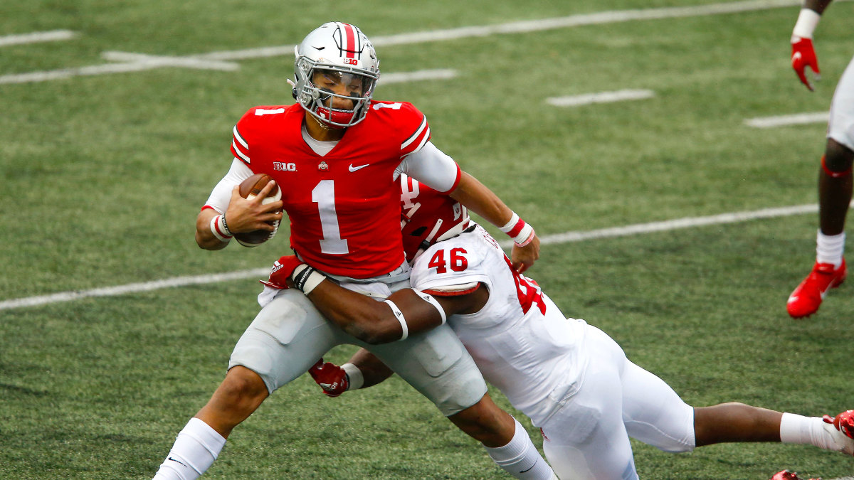 Ohio State QB Justin Fields gets wrapped up by an Indiana defender